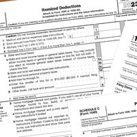 2023 tax forms on a desk.