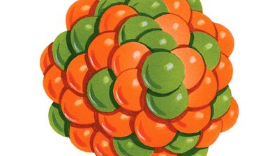 atom. Orange and green illustration of protons and neutrons creating the nucleus of an atom.