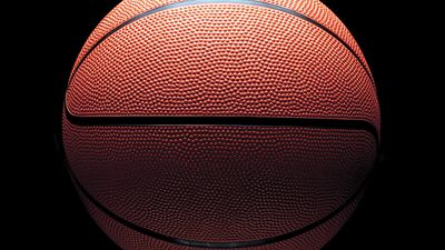 Orange basketball on black background and with low key lighting. Homepage 2010, arts and entertainment, history and society