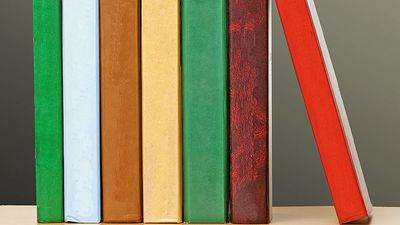 Row of colorful books on a bookshelf. Stack of books, pile of books, literature, reading. Homepage 2010, arts and entertainment, history and society