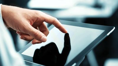 White male businessman works a touch screen on a digital tablet. Communication, Computer Monitor, Corporate Business, Digital Display, Liquid-Crystal Display, Touchpad, Wireless Technology, iPad