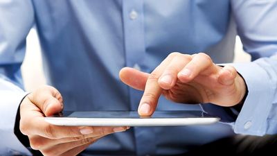 White male businessman works a touch screen on a digital tablet. Communication, Computer Monitor, Corporate Business, Digital Display, Liquid-Crystal Display, Touchpad, Wireless Technology, iPad