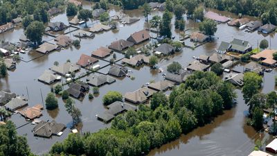 Houses are submerged in floodwaters on August 31, 2017,  in a neighborhood of Port Arthur, Texas  after Hurricane Harvey battered the coast of Texas in August, 2017. Natural disaster