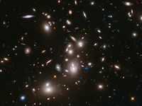 Galaxy clusters like Abell 2744 can act as a natural cosmic lens, magnifying light from more distant, background objects through gravity. NASA's James Webb Space Telescope may be able to detect light from the first stars in the universe if they are gravitationally lensed by such clusters. (astronomy, space exploration, galaxies)