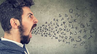 Man screaming with alphabet letters flying from his mouth (anger, rage, aggression, emotions).