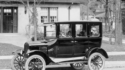 A model 'T' Ford motor-car outside a suburban house, 1924.