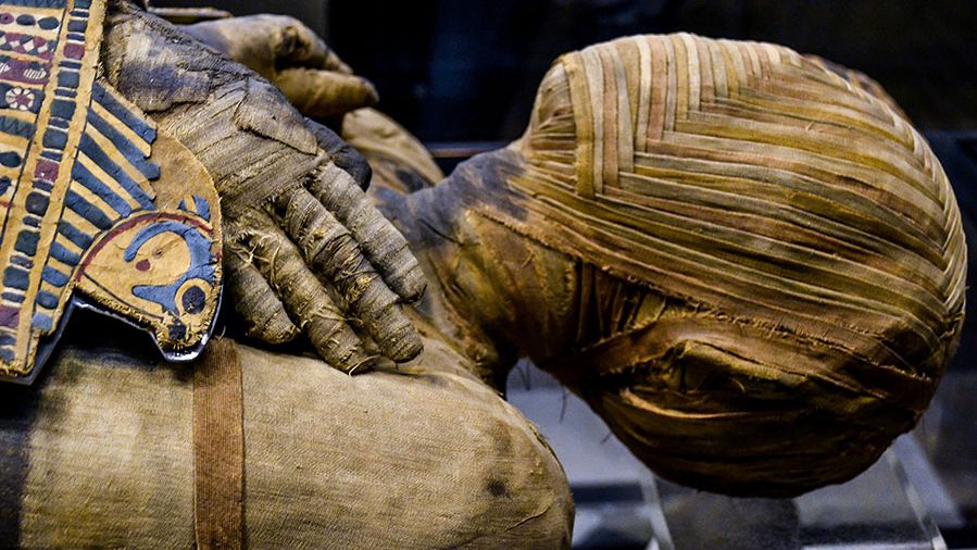 This extremely well preserved Egyptian mummy is that of a man who lived during the Ptolemaic Period. His name, written hastily, can be read as either Pachery or Nenu; in the collection of the Musee du Louvre, Paris, France.