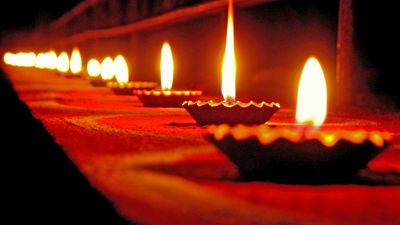 Diwali holiday lamps or candles, India.  (Indian holiday, oil lamp, flame,  candle, fire)