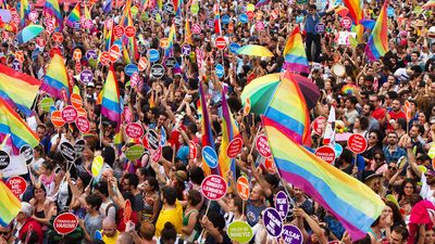 People in Taksim Square for LGBT pride parade on June 30, 2013 in Istanbul, Turkey. Almost 100.000 people attracted to pride parade and the biggest pride ever held in Turkey.