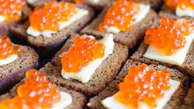 Red caviar on rye bread and butter, salmon