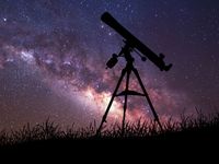 Infinite space background with silhouette of telescope. This image elements furnished by NASA.