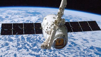 The SpaceX Dragon commercial cargo craft is grappled by the International Space Station's Canadarm2 robotic arm. October 10, 2012.