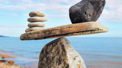 Well-balanced of stones on the top of boulder