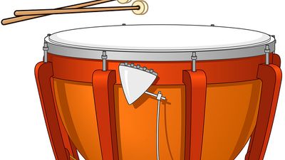 Timpani, or kettledrum, and drumsticks. Musical instrument, percussion instrument, drumhead, timpany, tympani, tympany, membranophone, orchestral instrument.